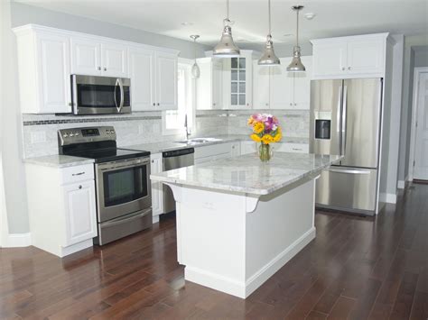 pine cabinets with stainless steel appliances white counter tops|white appliances for cabinets.